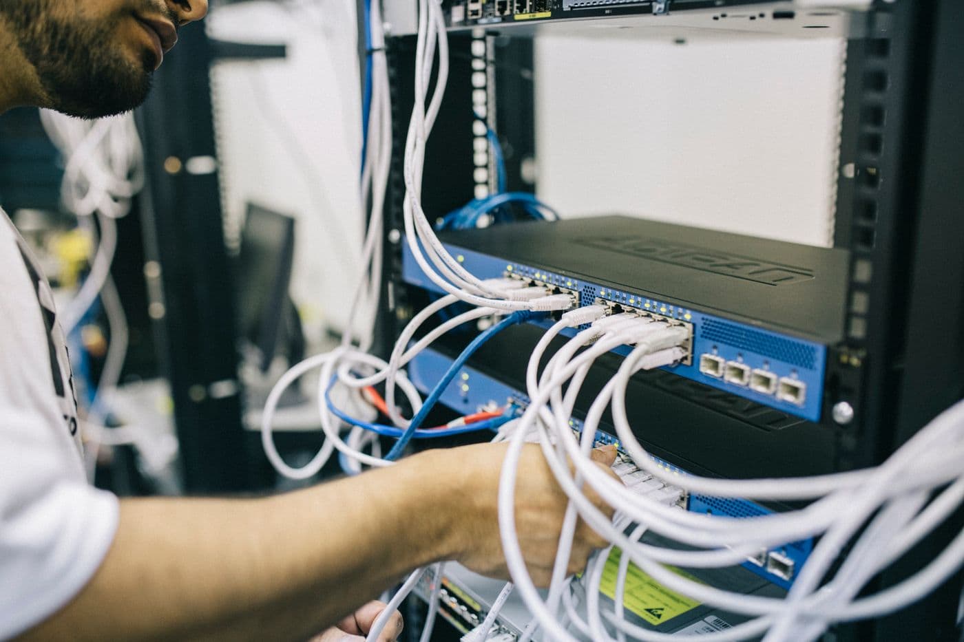 Technician connecting network equipment