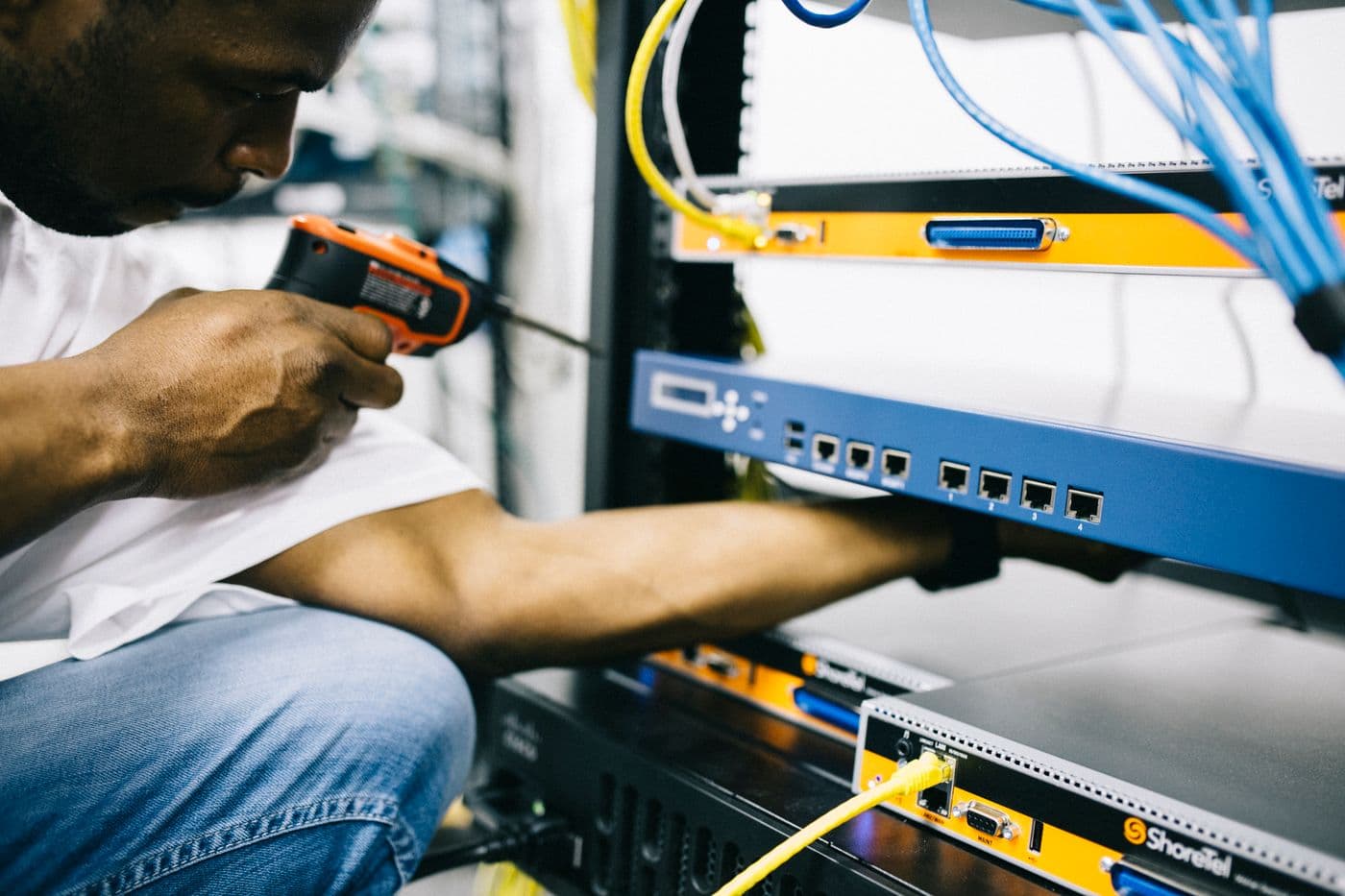 Technician working directly on equipment installation